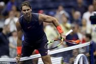 Rafael Nadal hops over the net to congratulate Dominic Thiem after their 2018 US Open quarter-final